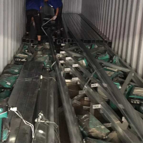 tiny-prefab-house-material-container-loading